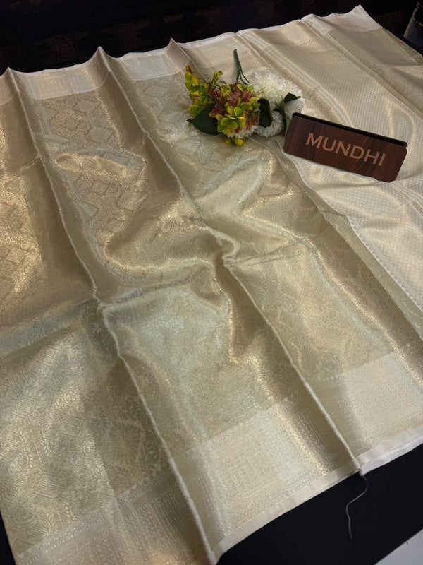 Experience the perfect balance of luxury and tradition with the New Celebrity Tissue Zari Saree.