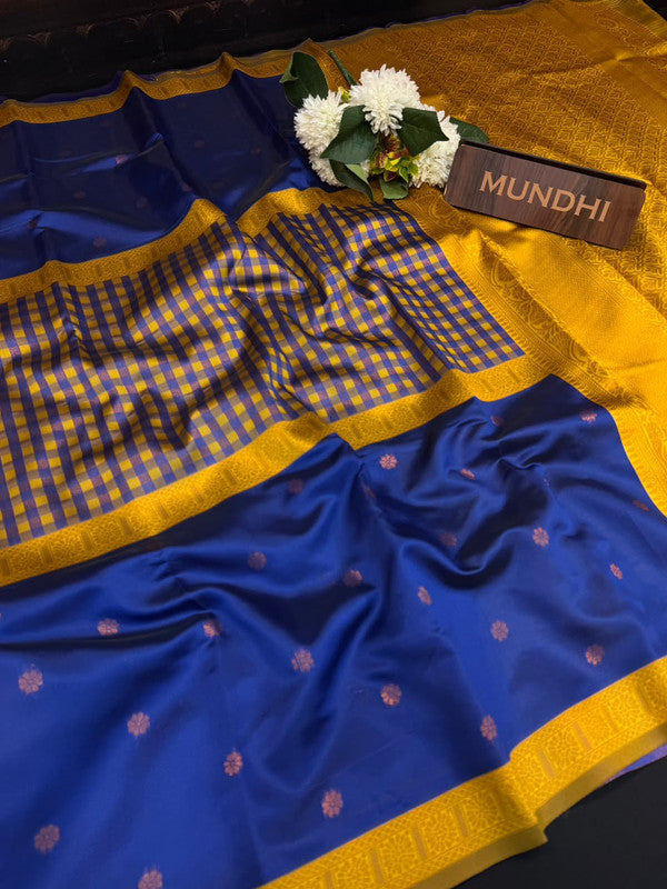 Centre checked soft silk type saree with traditional zari work.