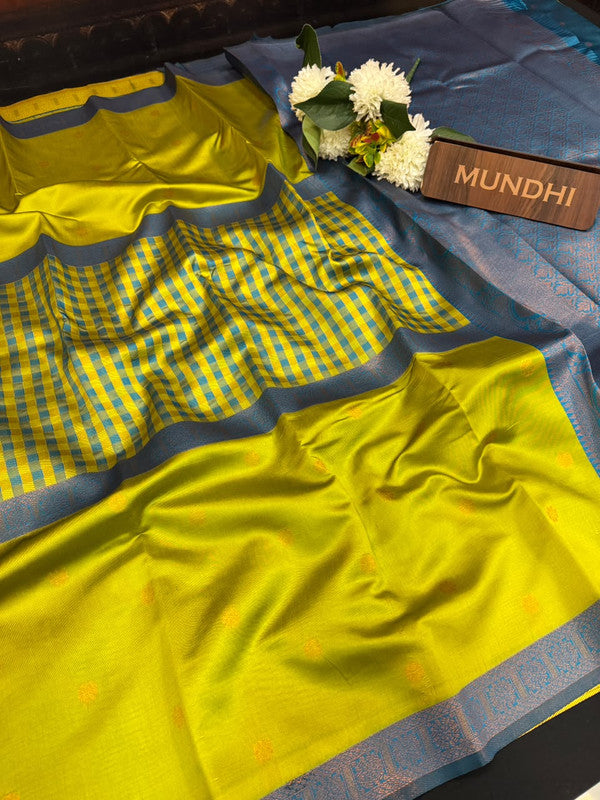 Centre checked soft silk type saree with traditional zari work.