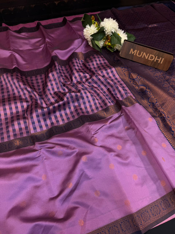 Centre checked soft silk type saree with traditional zari work.