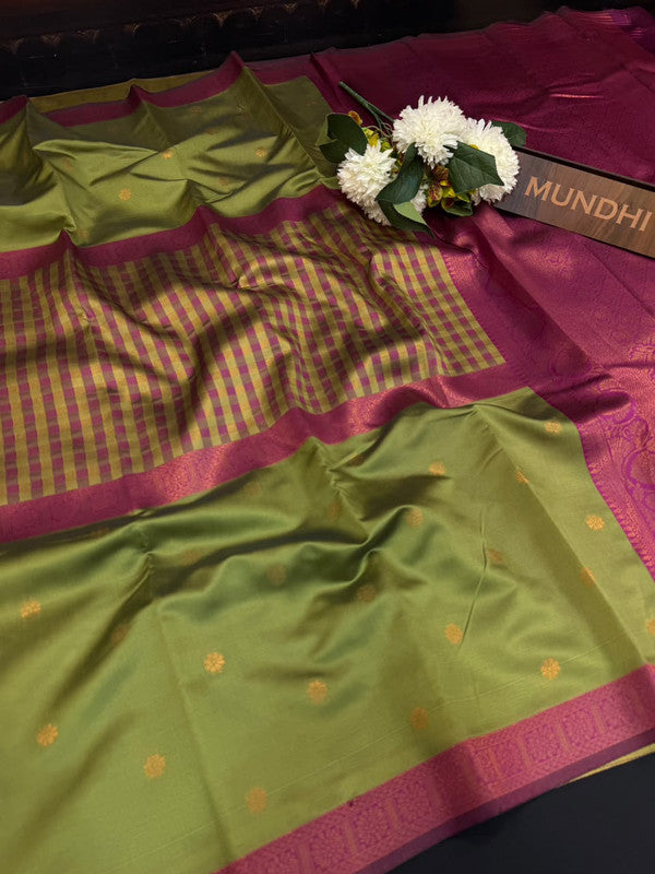 Centre checked soft silk type saree with traditional zari work.