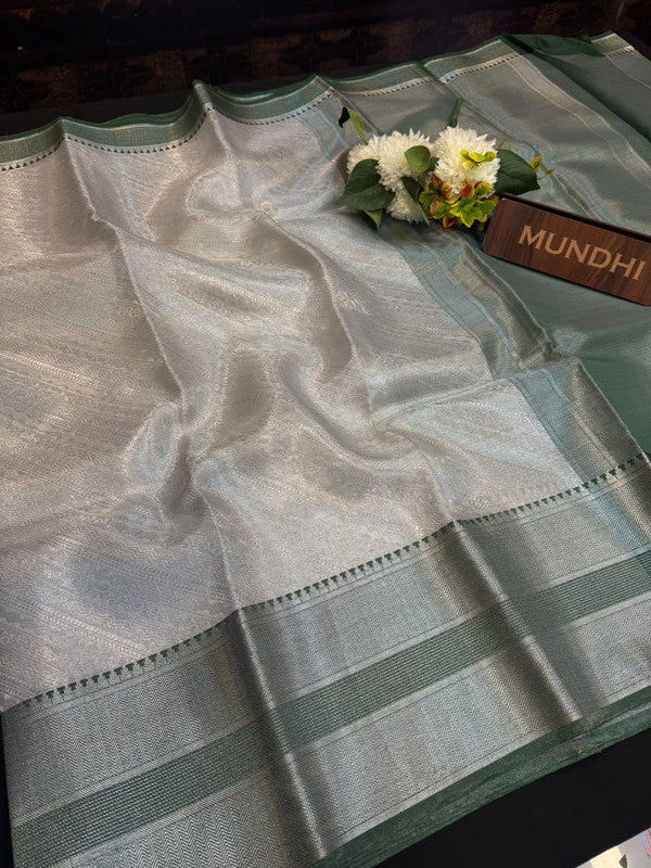 Experience the perfect balance of luxury and tradition with the New Celebrity Tissue Zari Saree.