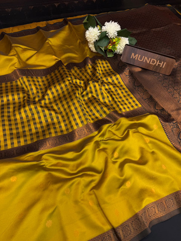 Centre checked soft silk type saree with traditional zari work.