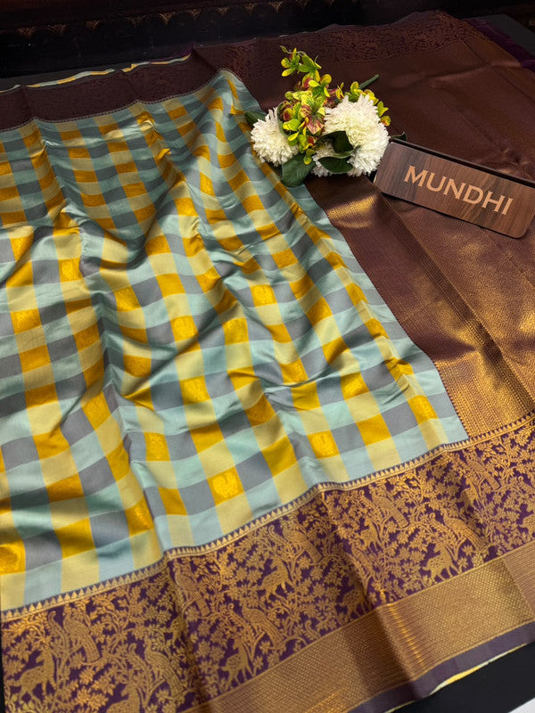 Checked Pavishna Saree in soft silk type fabric with elegant zari work